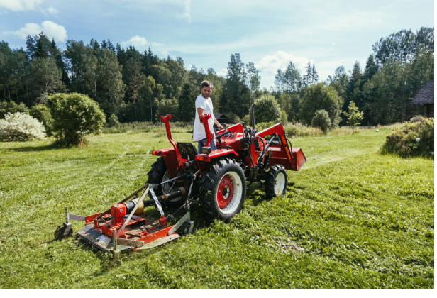 Aerial view of a One Solution tractor with triple gang mowers striping a large turf area