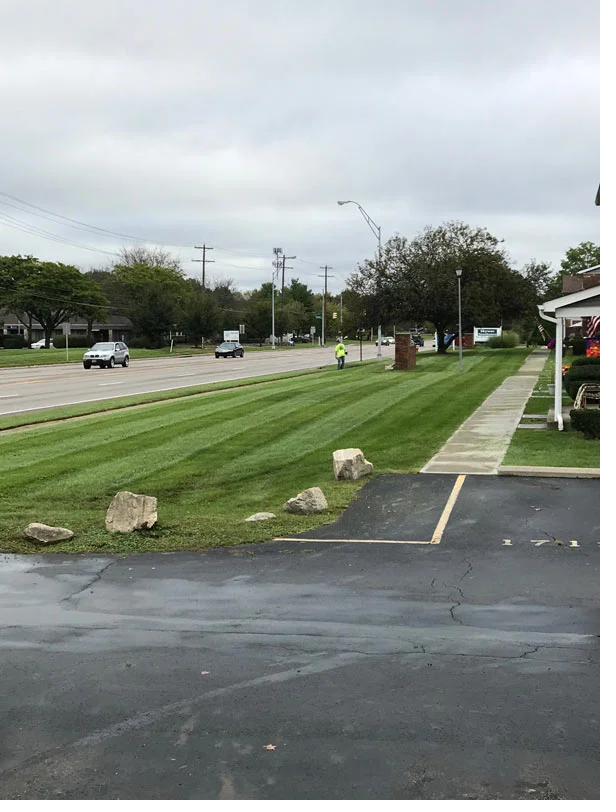 Striped commercial lawn in front of an office headquarters